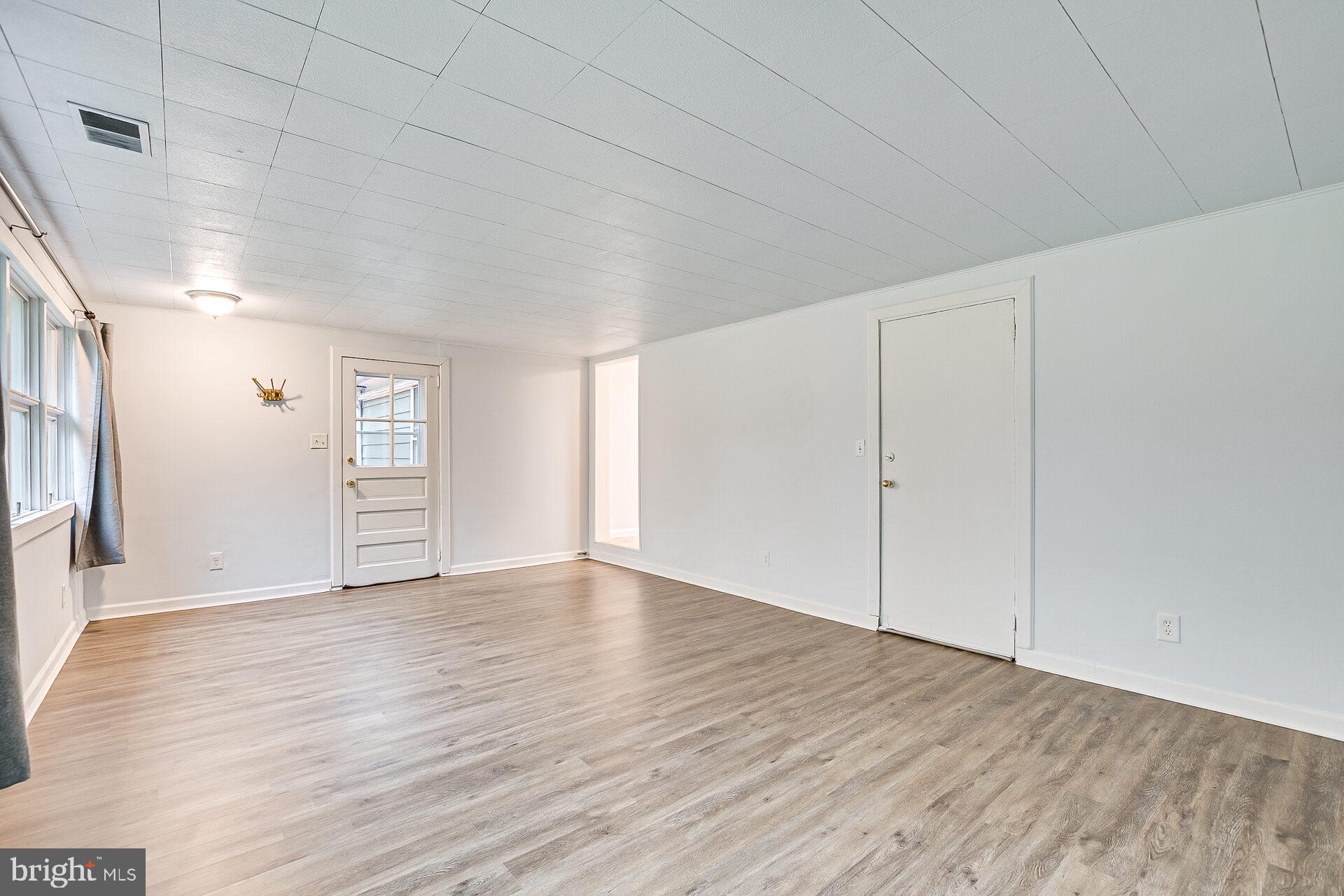 47 Wallace Road Princeton Junction, NJ 08550 - Photo 13 of 27 a view of an empty room with wooden floor and closet