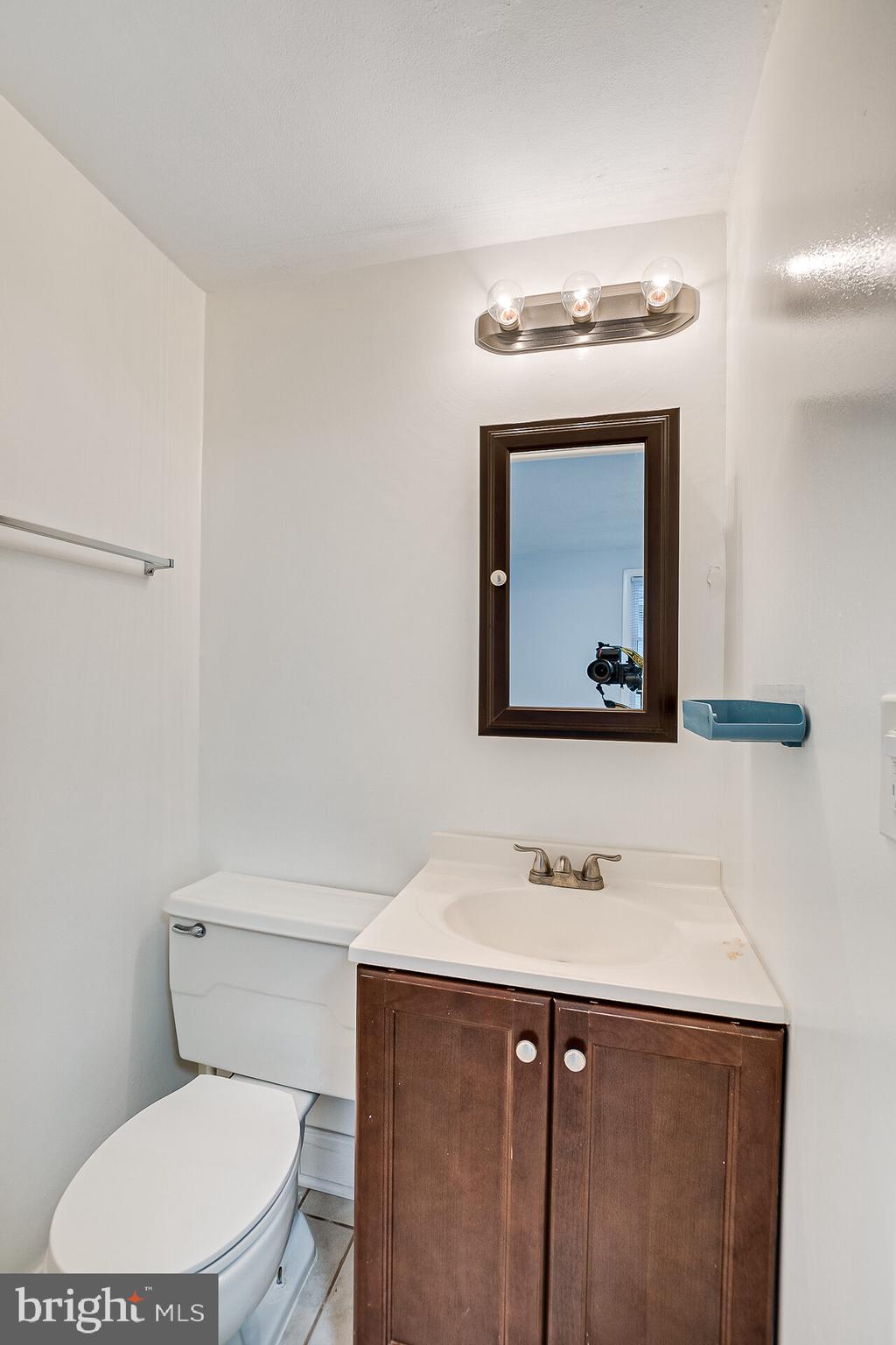 47 Wallace Road Princeton Junction, NJ 08550 - Photo 16 of 27 a bathroom with a sink vanity mirror and toilet