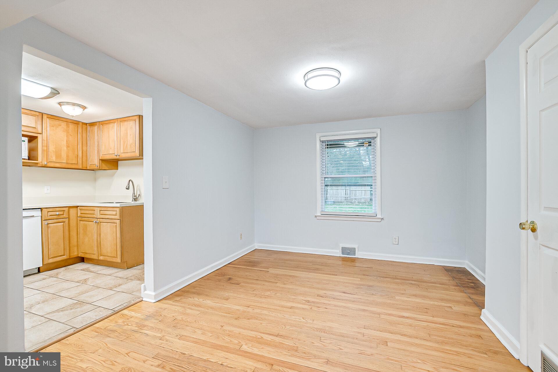 47 Wallace Road Princeton Junction, NJ 08550 - Photo 6 of 27 a view of empty room with window and wooden floor