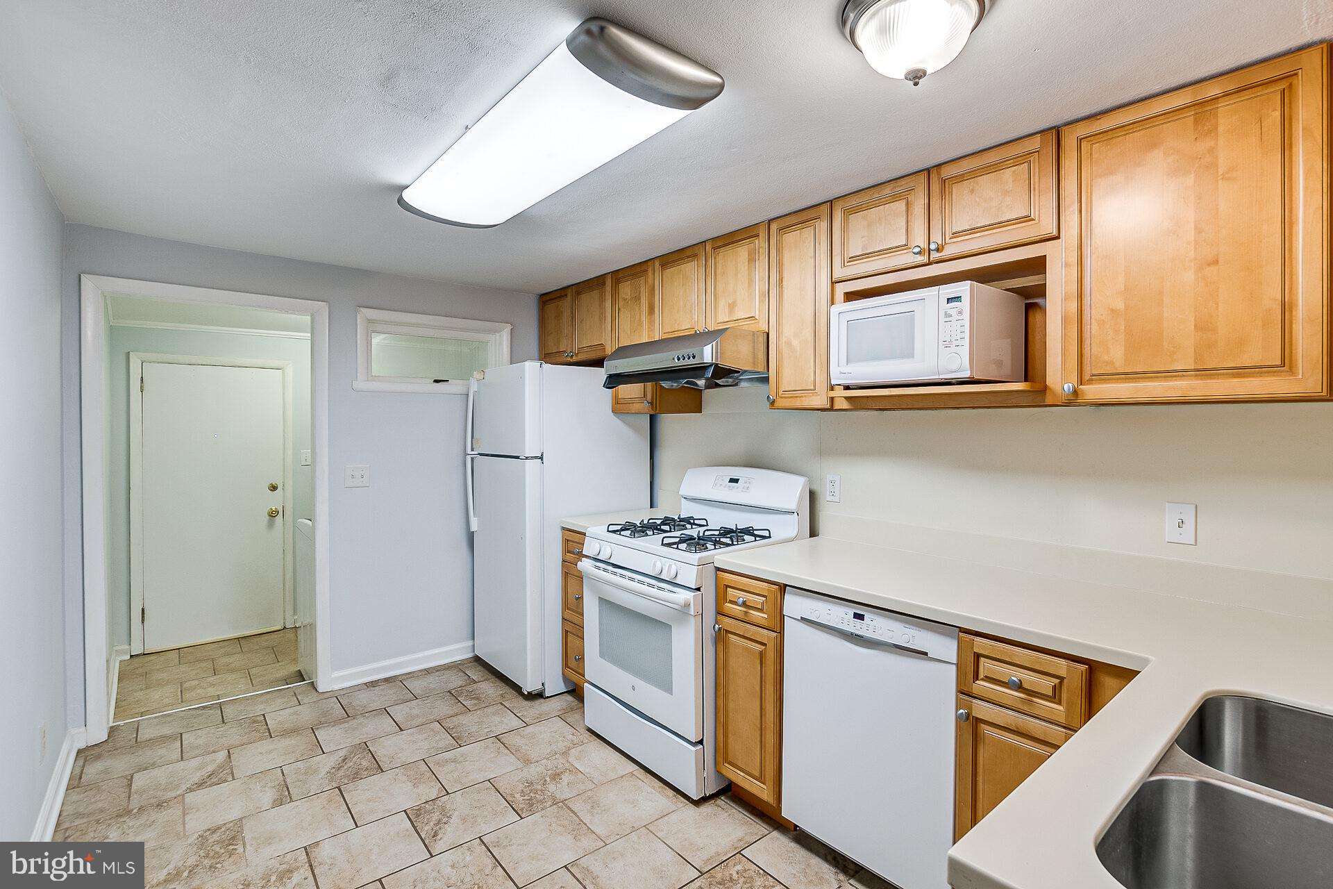 47 Wallace Road Princeton Junction, NJ 08550 - Photo 9 of 27 a kitchen with stainless steel appliances granite countertop a stove and a microwave