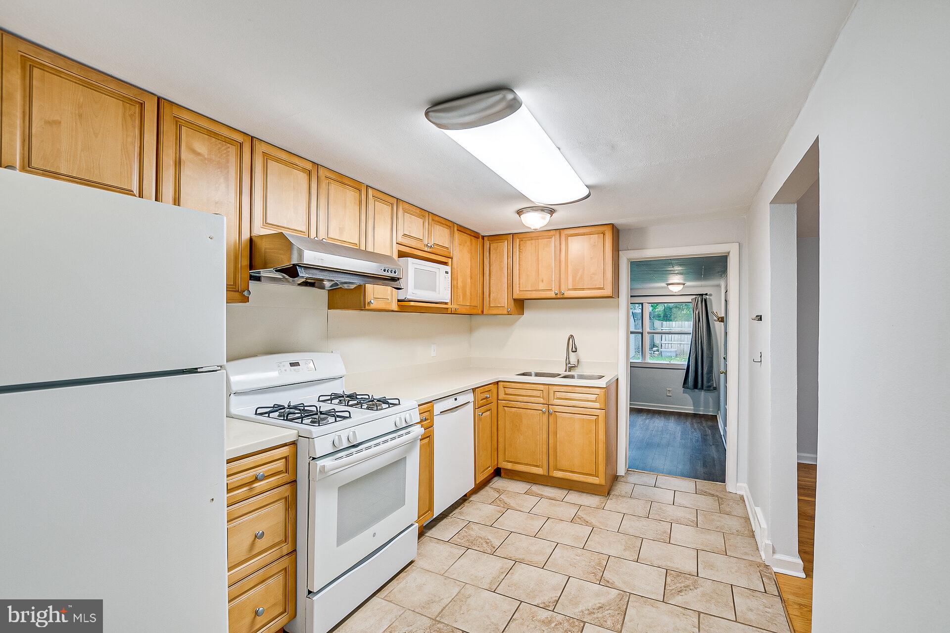 47 Wallace Road Princeton Junction, NJ 08550 - Photo 10 of 27 a kitchen with stainless steel appliances granite countertop a refrigerator a stove and a sink with granite countertops