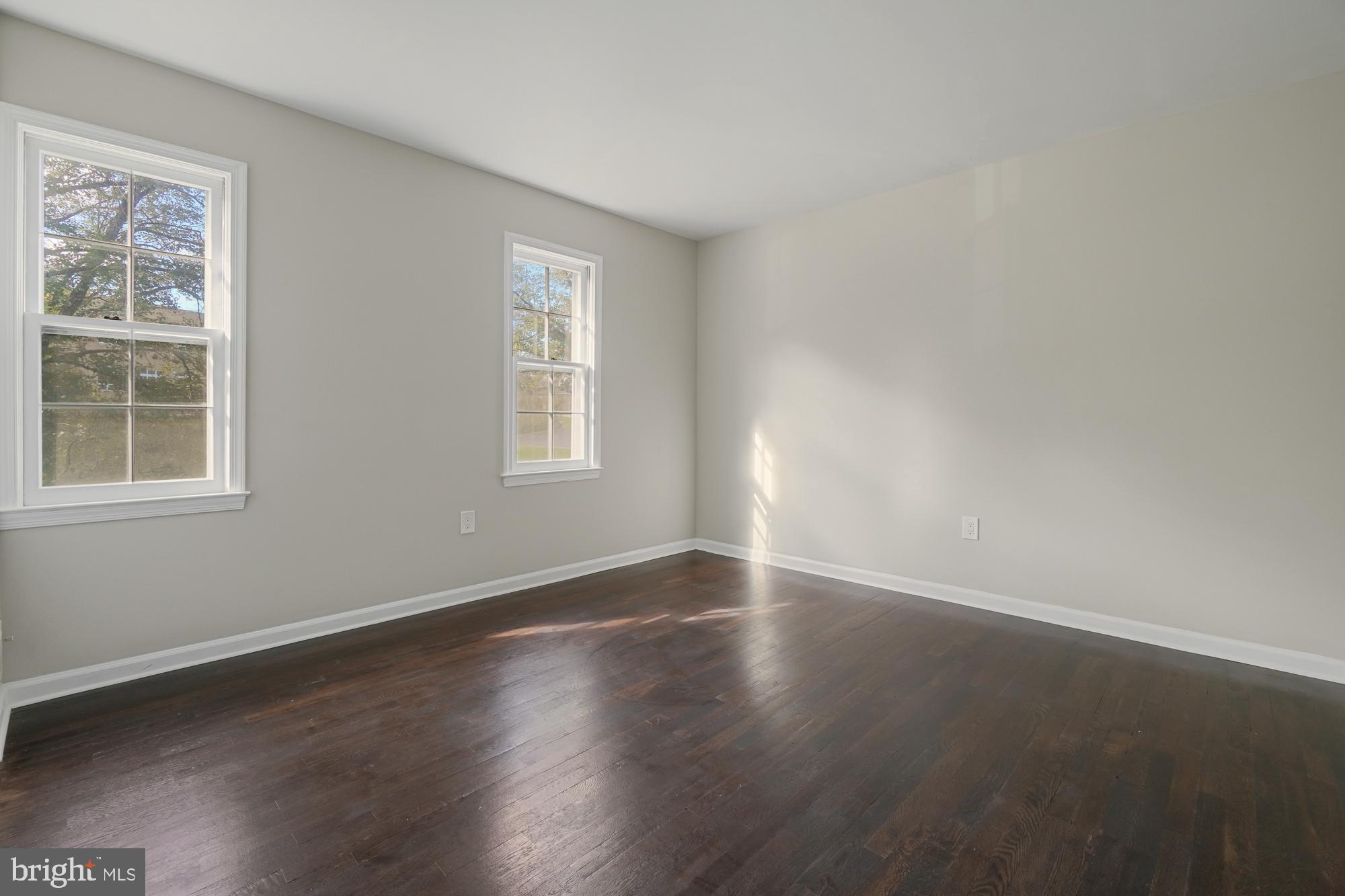 12539 Heurich Road Silver Spring, MD 20902 - Photo 26 of 46 an empty room with wooden floor and windows