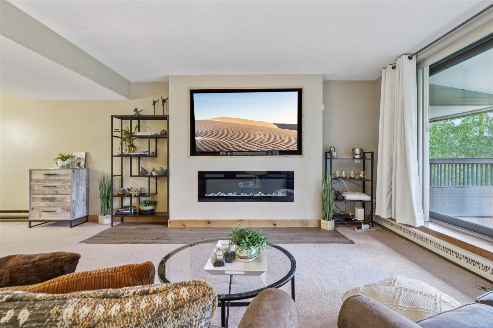22097 Saints John Road, Unit 2506 Keystone, CO 80435 - Photo 2 of 47 Living room with carpet flooring, a glass covered fireplace, and baseboard heating