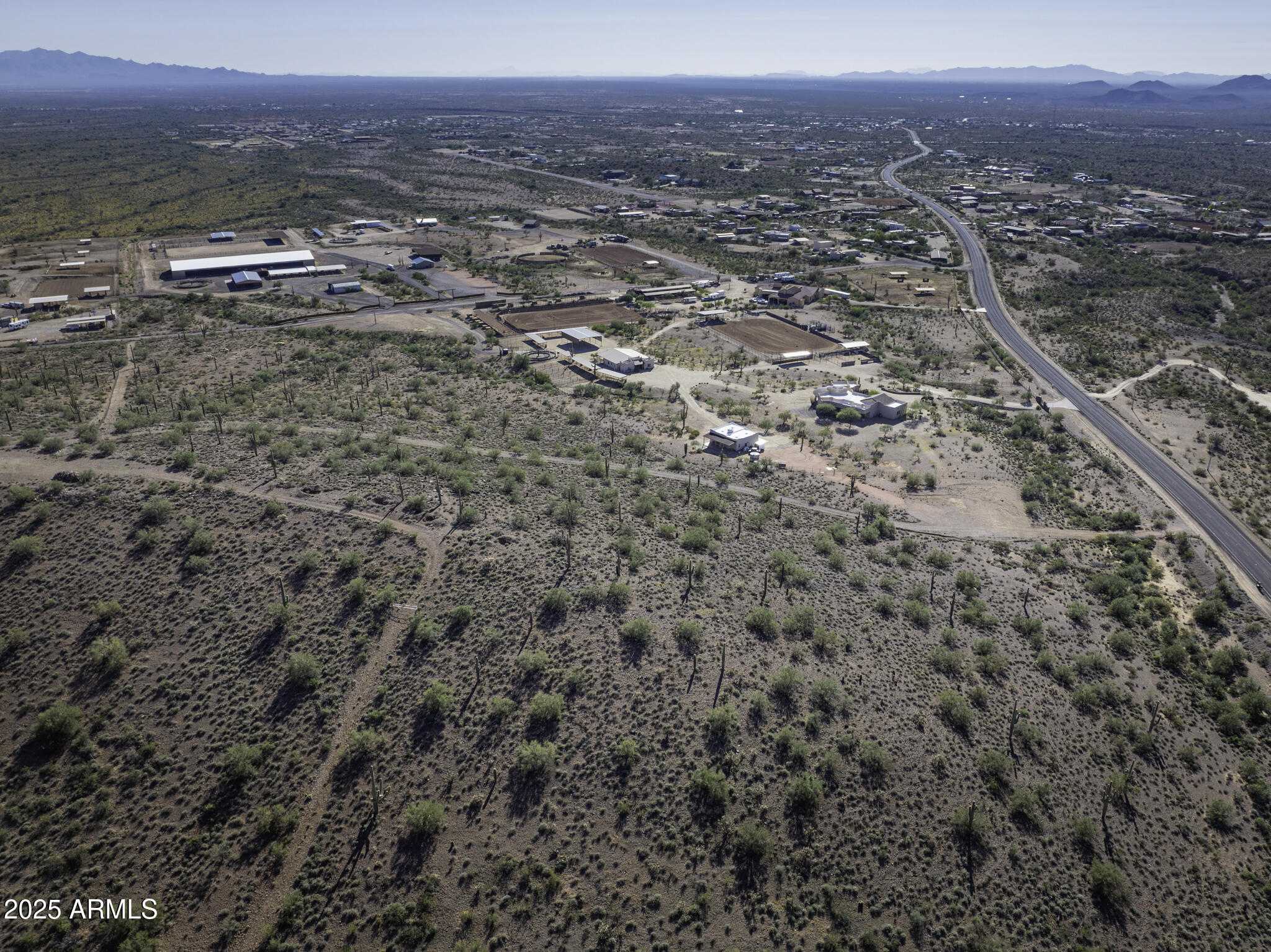 43327 North Castle Hot Springs Road, Unit TOP Morristown, AZ 85342 - Photo 15 of 15 an aerial view of multiple house