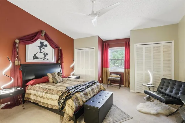 a bedroom with a bed and a couch