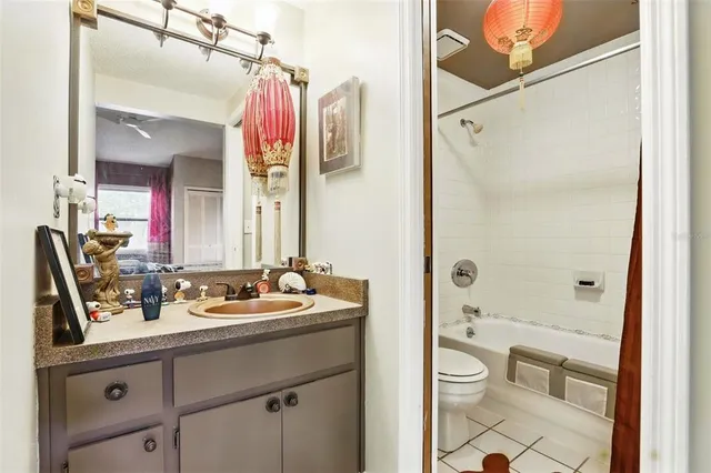 a bathroom with a sink a toilet a shower and a mirror