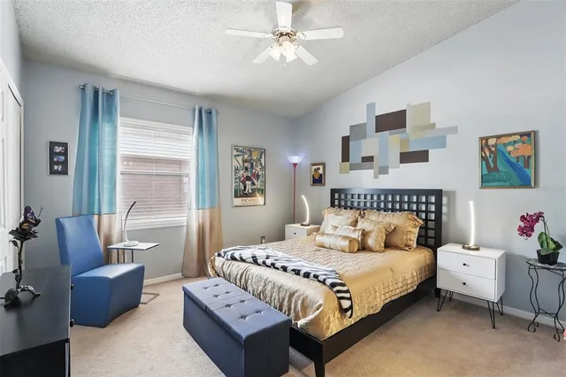 a bedroom with bed and a couch