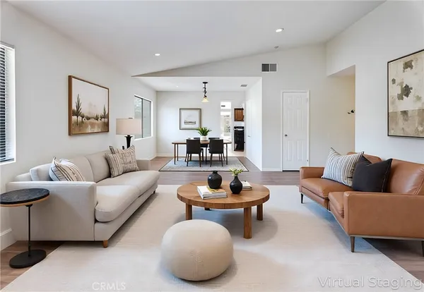 a living room with furniture and a rug
