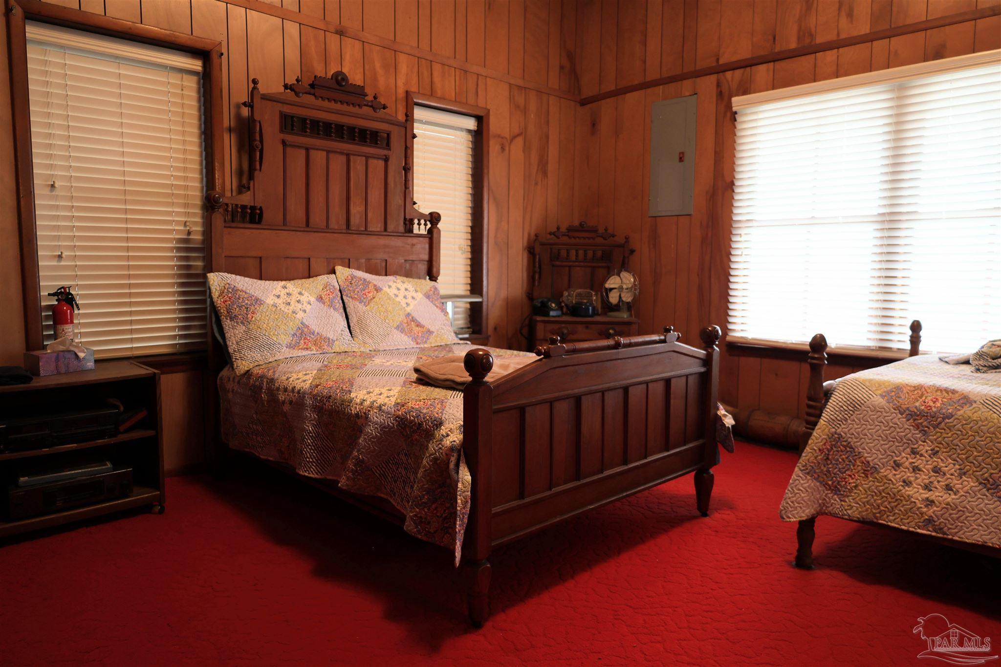 9023 County Road Millry, AL 36558 - Photo 15 of 72 a bedroom with a bed and a window