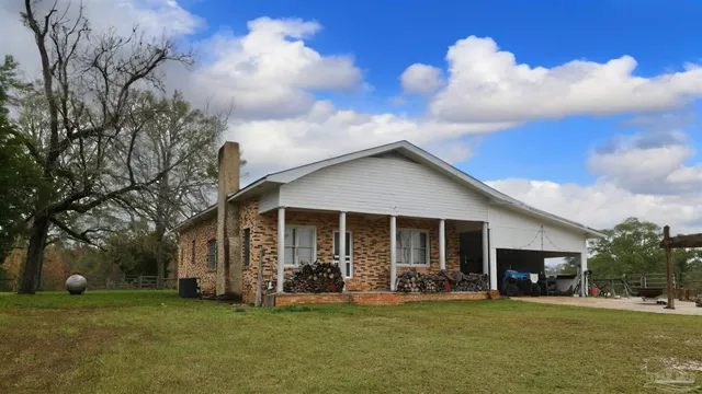 a view of a house with a big yard