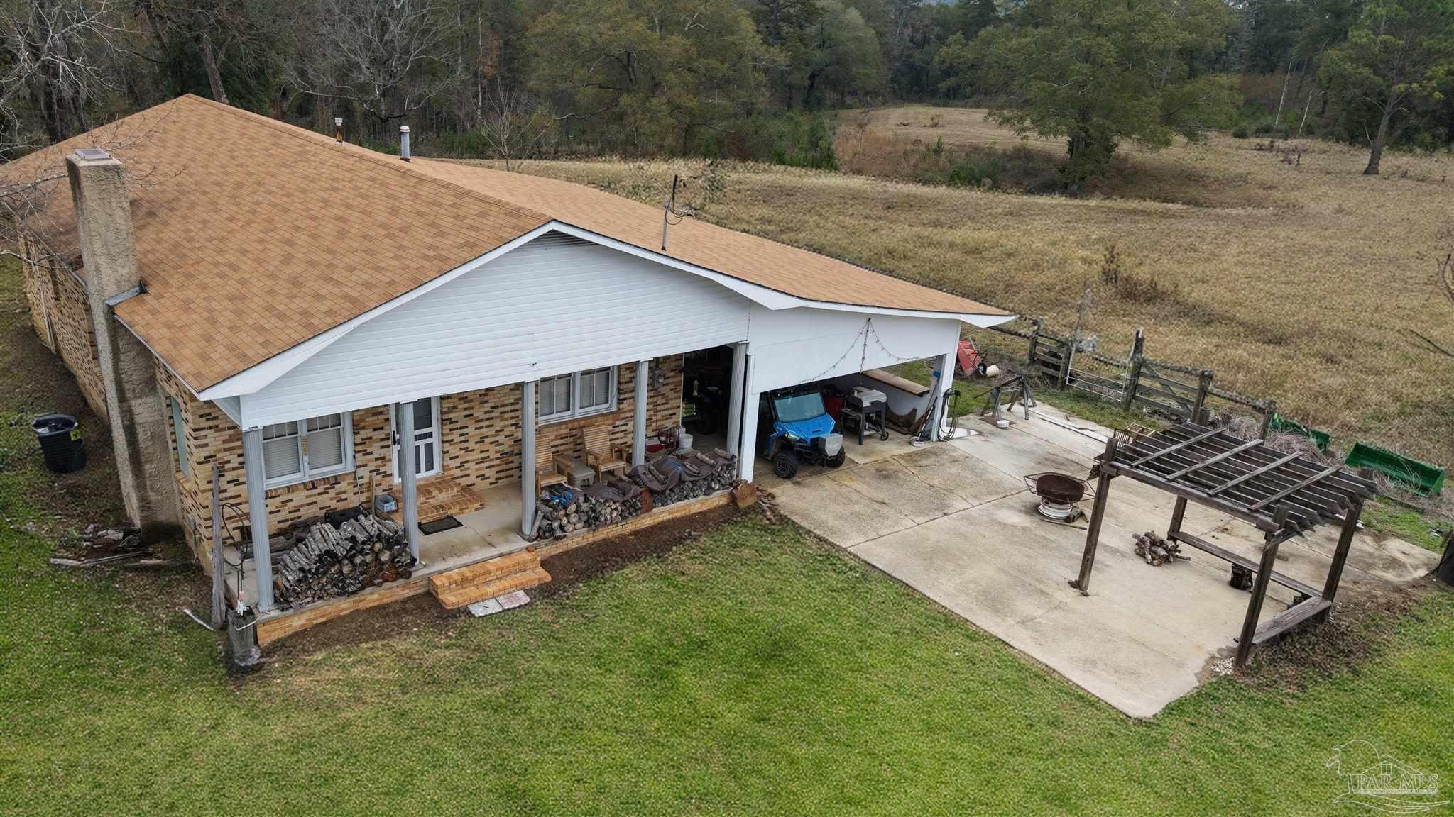 9023 County Road Millry, AL 36558 - Photo 23 of 72 a view of a house with backyard and sitting area