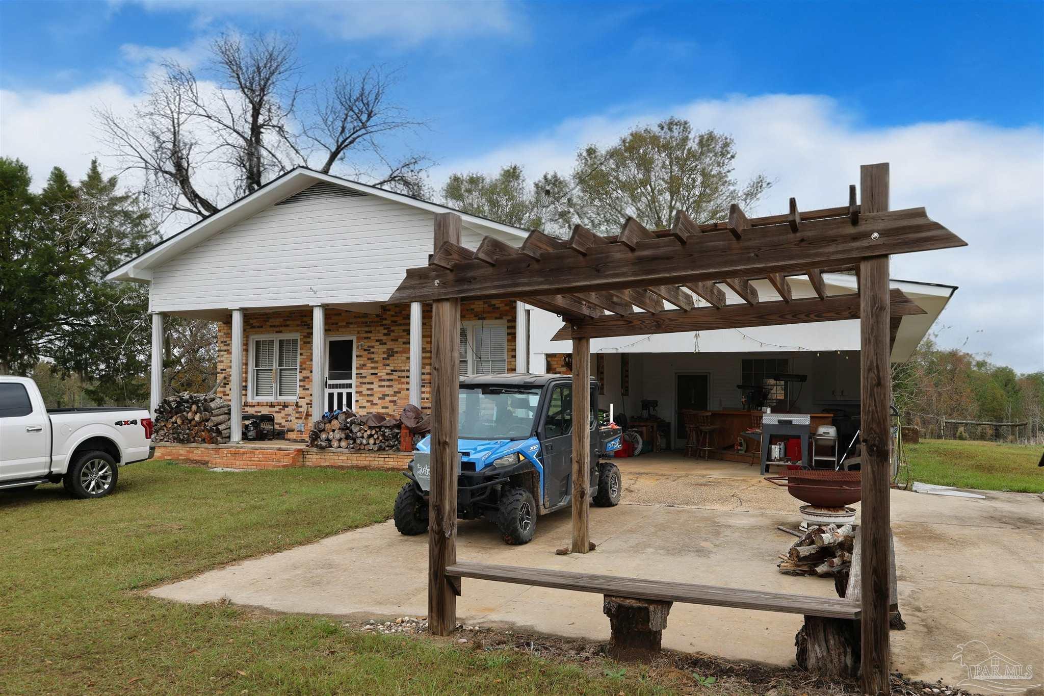 9023 County Road Millry, AL 36558 - Photo 25 of 72 a view of a house with a patio