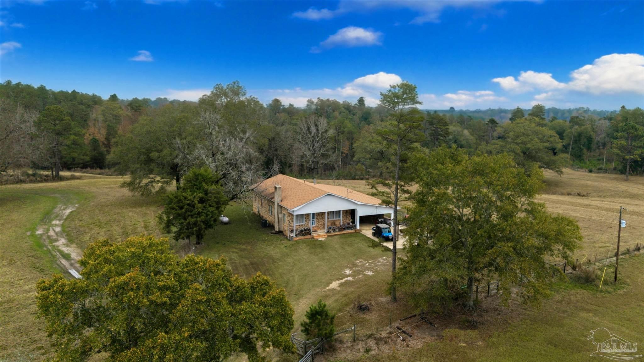 9023 County Road Millry, AL 36558 - Photo 40 of 72 a view of a house with a yard and lake view