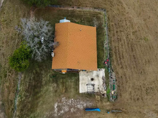 a view of a park with slide and a lake view