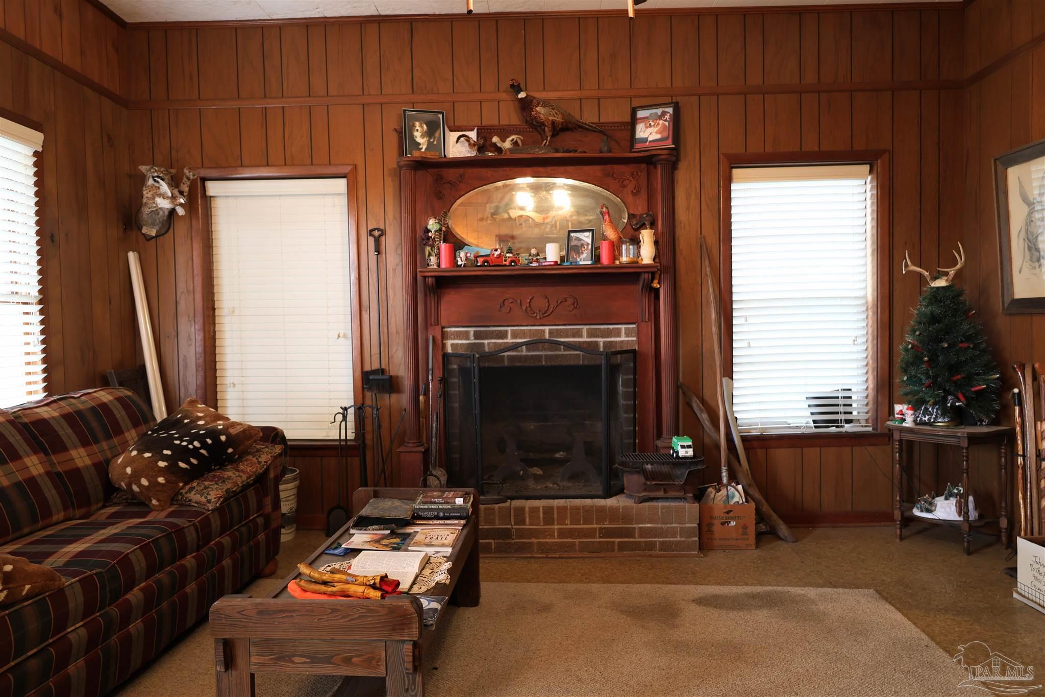 9023 County Road Millry, AL 36558 - Photo 4 of 72 a living room with furniture a fireplace and a flat screen tv