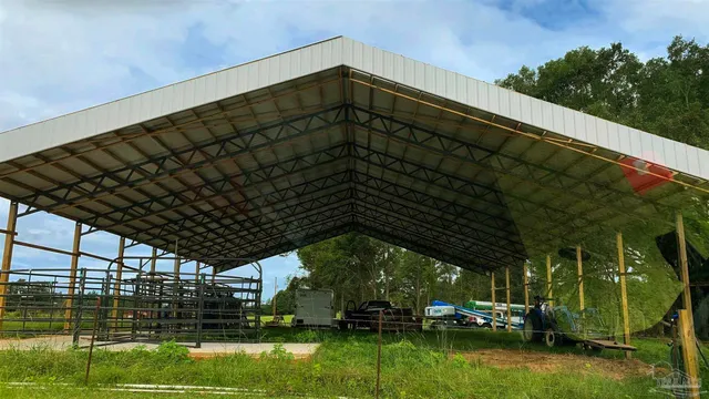 a view of a table and chairs in the garden