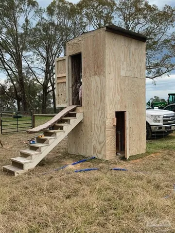 a bird view of a house next to a yard