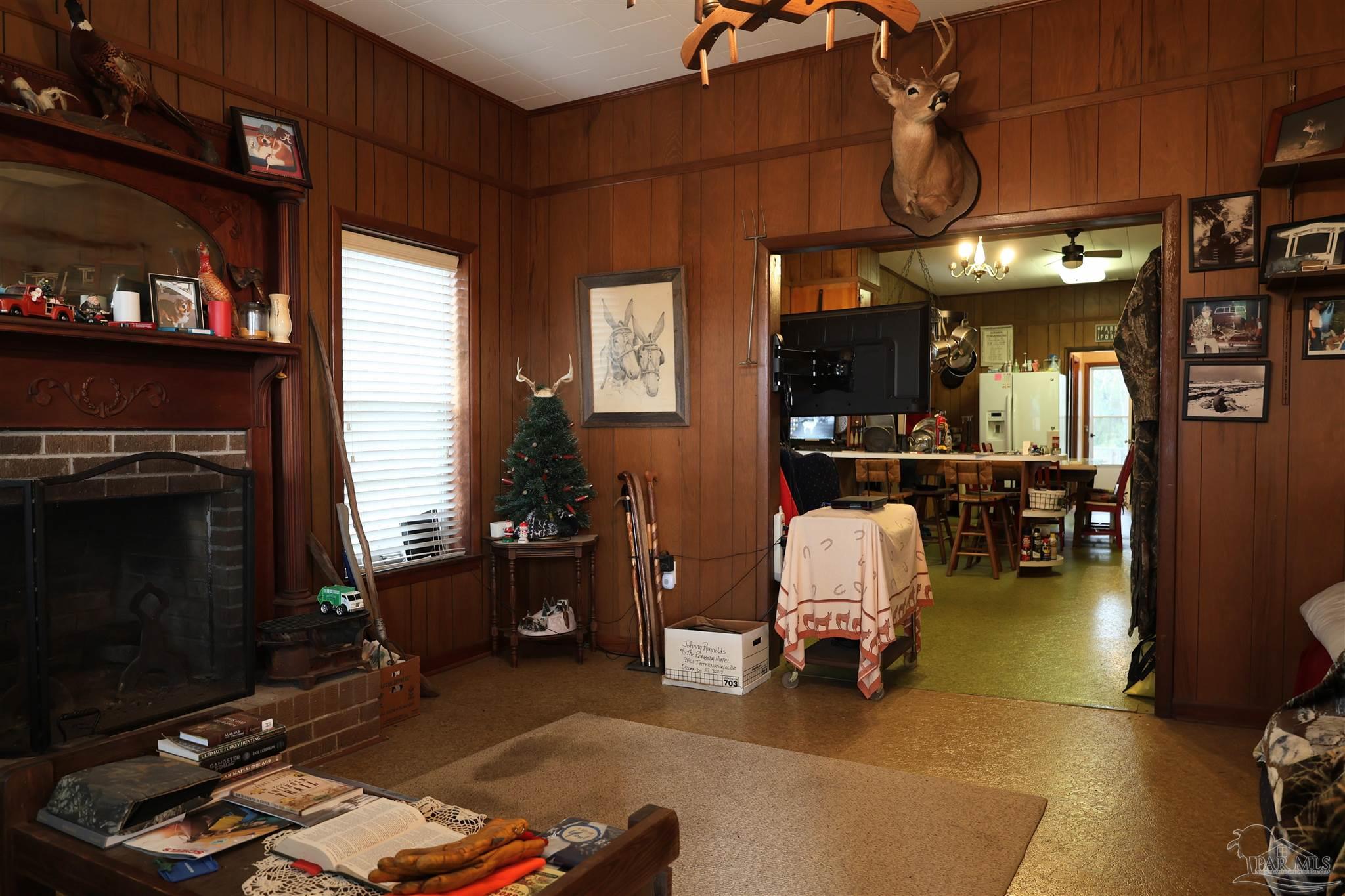 9023 County Road Millry, AL 36558 - Photo 8 of 72 a living room with furniture and a fireplace