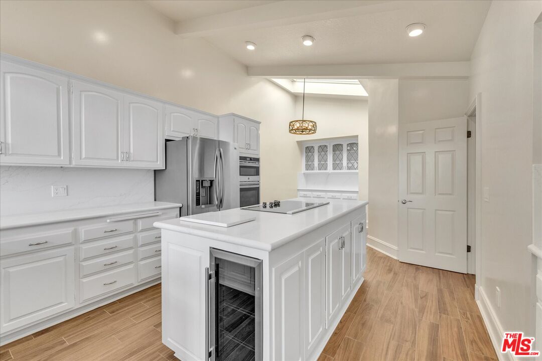 2202 The Terrace Los Angeles, CA 90049 - Photo 15 of 40 a kitchen with a sink stove and refrigerator