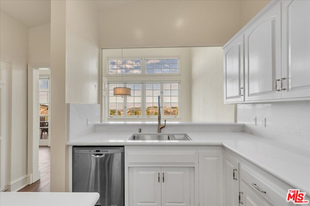 2202 The Terrace Los Angeles, CA 90049 - Photo 21 of 40 a view with granite countertop a sink and a window