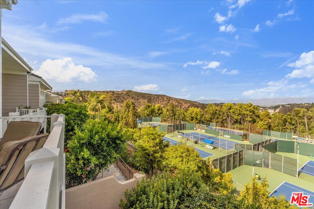 2202 The Terrace Los Angeles, CA 90049 - Photo 24 of 40 a view of swimming pool with outdoor seating and city view