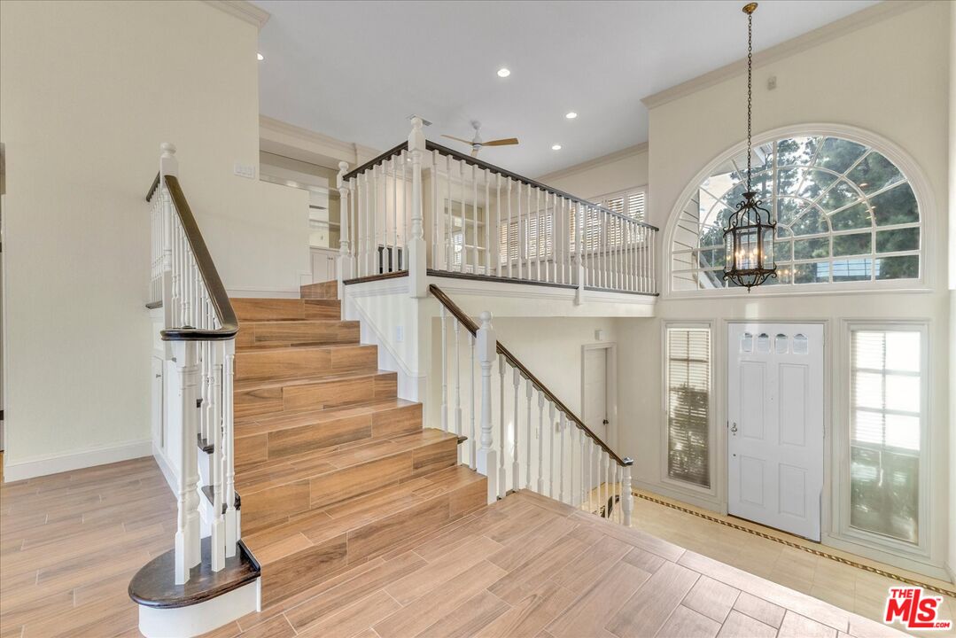 2202 The Terrace Los Angeles, CA 90049 - Photo 25 of 40 a view of entryway and hall with wooden floor
