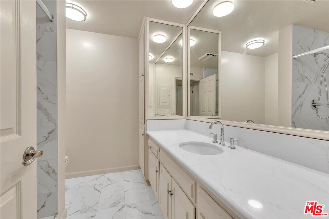 2202 The Terrace Los Angeles, CA 90049 - Photo 38 of 40 a bathroom with a double vanity sink mirror and double