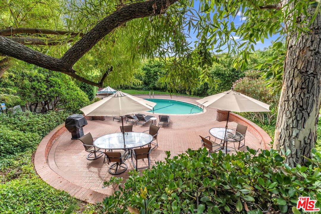 2202 The Terrace Los Angeles, CA 90049 - Photo 6 of 40 an aerial view of a house with garden space and trees