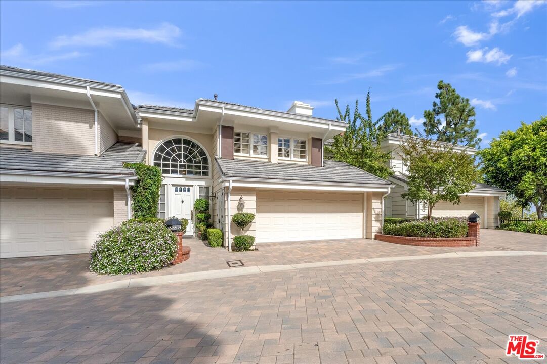 2202 The Terrace Los Angeles, CA 90049 - Photo 7 of 40 a front view of a house with garden