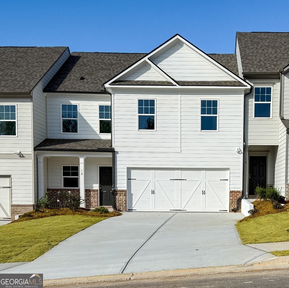 a view of a yard in front view of a house