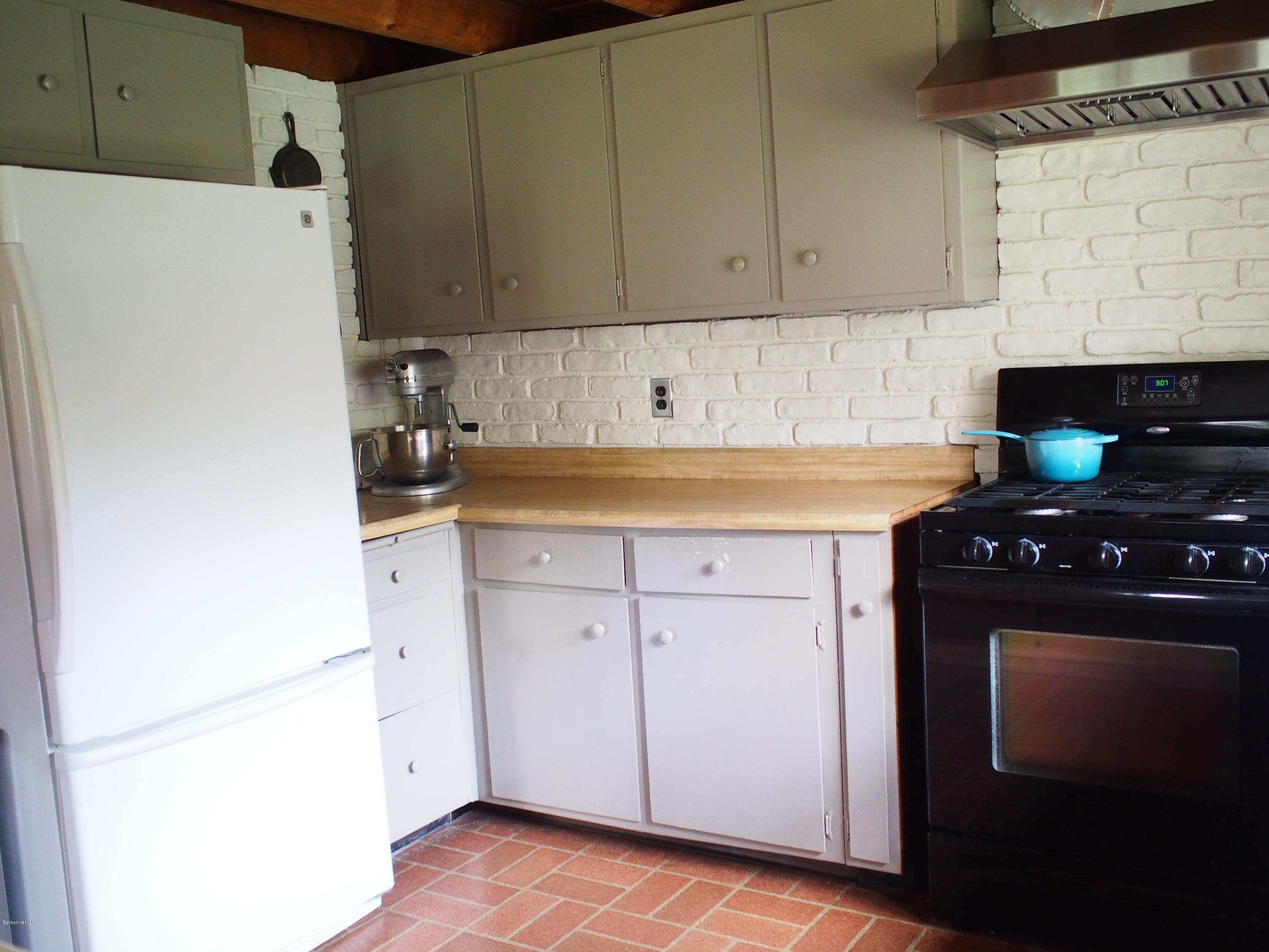 52 Central Shaft Road Florida, MA 01247 - Photo 11 of 31 a kitchen with a refrigerator and a stove