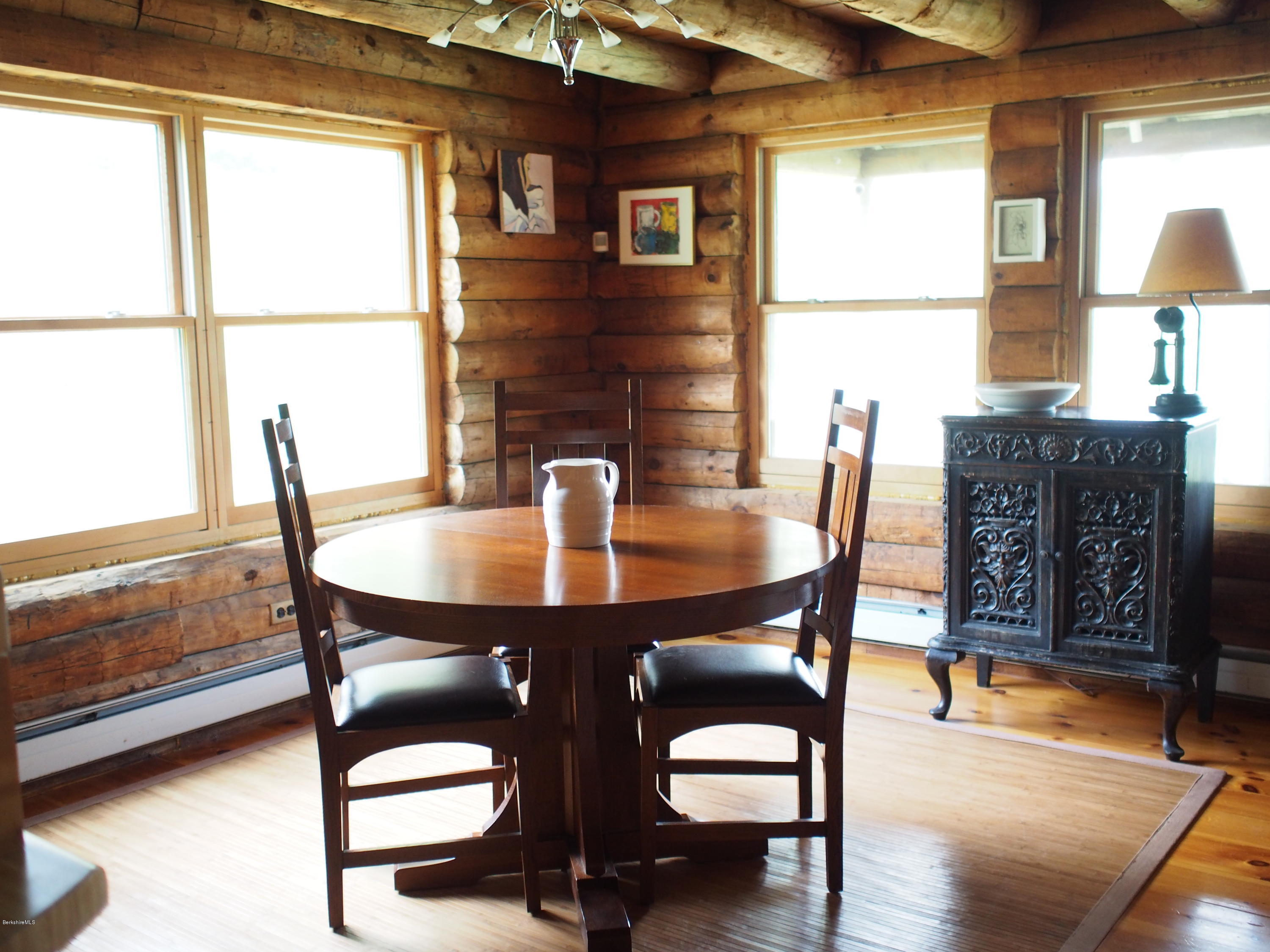 52 Central Shaft Road Florida, MA 01247 - Photo 13 of 31 a view of a dining room with furniture and wooden floor