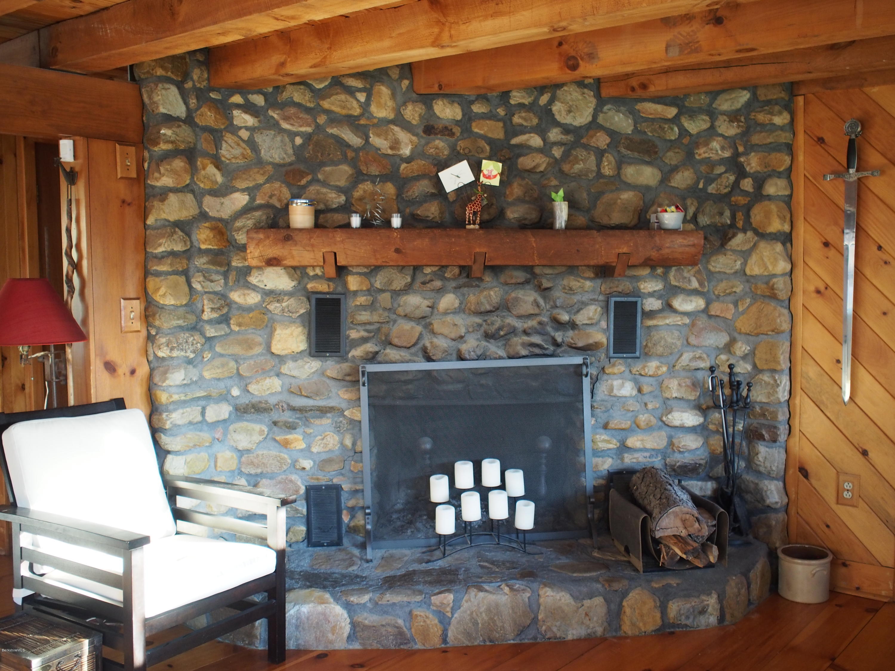 52 Central Shaft Road Florida, MA 01247 - Photo 16 of 31 a room with fireplace and wooden floor