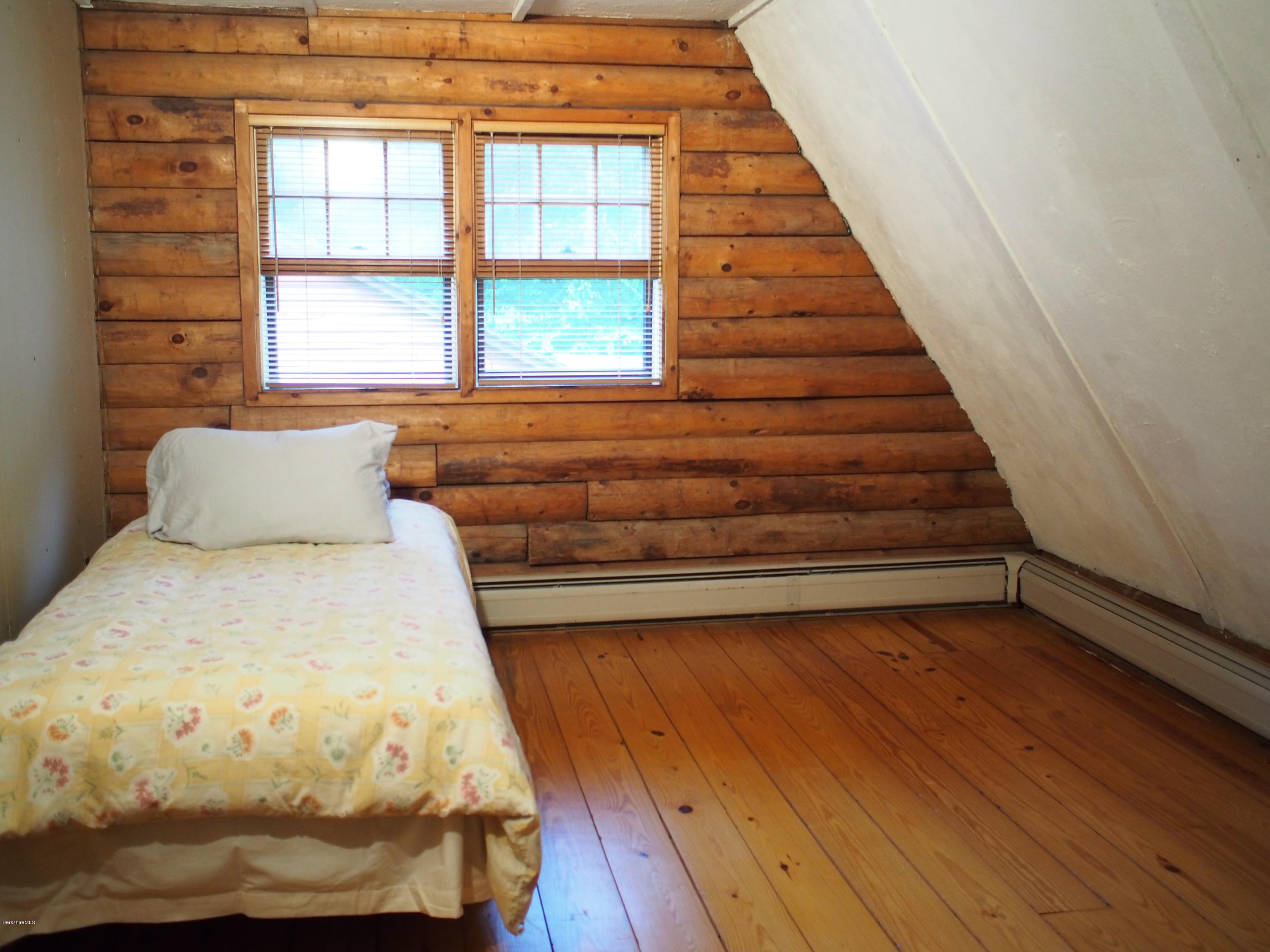 52 Central Shaft Road Florida, MA 01247 - Photo 20 of 31 a view of a livingroom with wooden floor and stairs