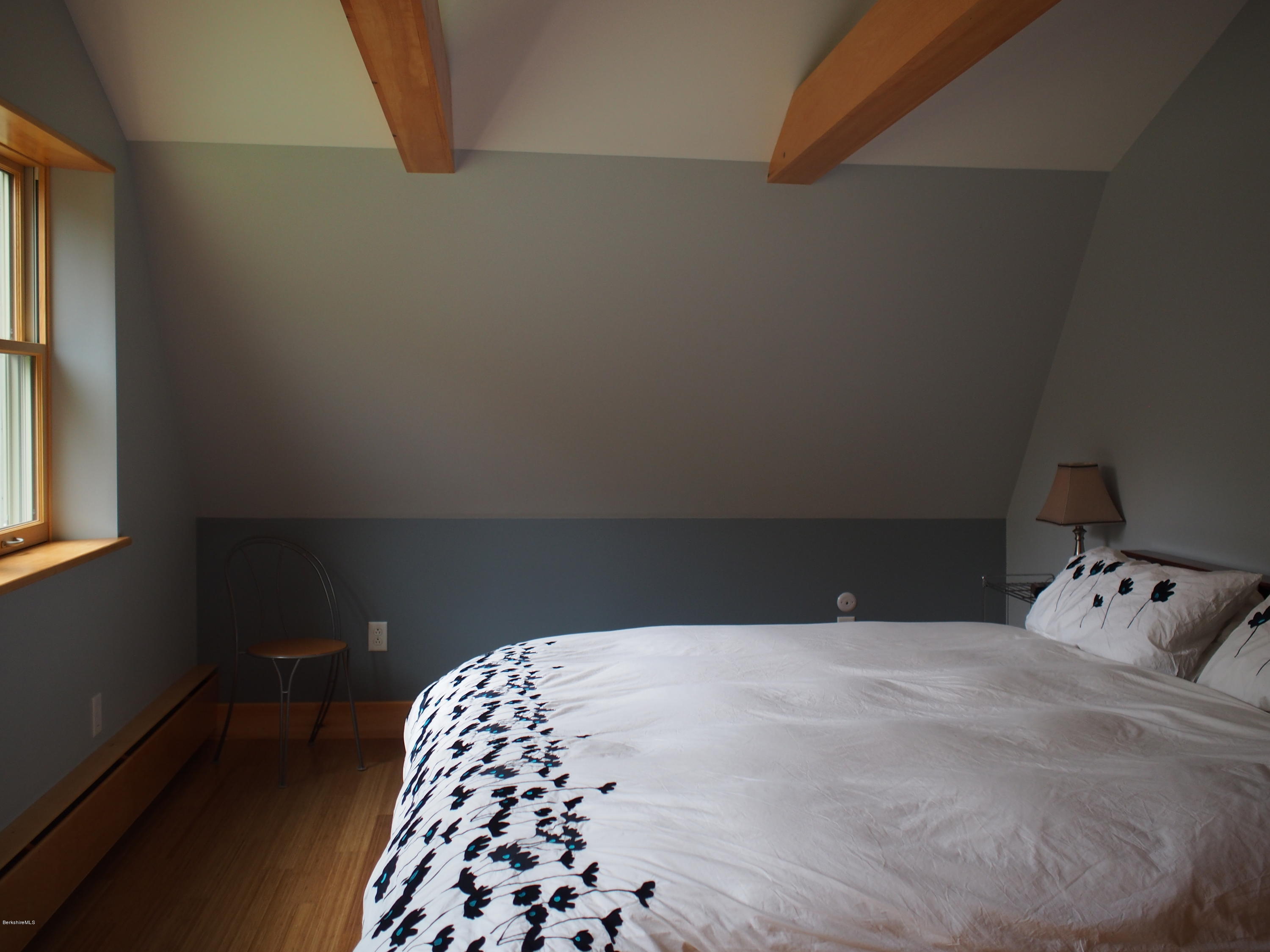 52 Central Shaft Road Florida, MA 01247 - Photo 22 of 31 a bedroom with a bed and a chair