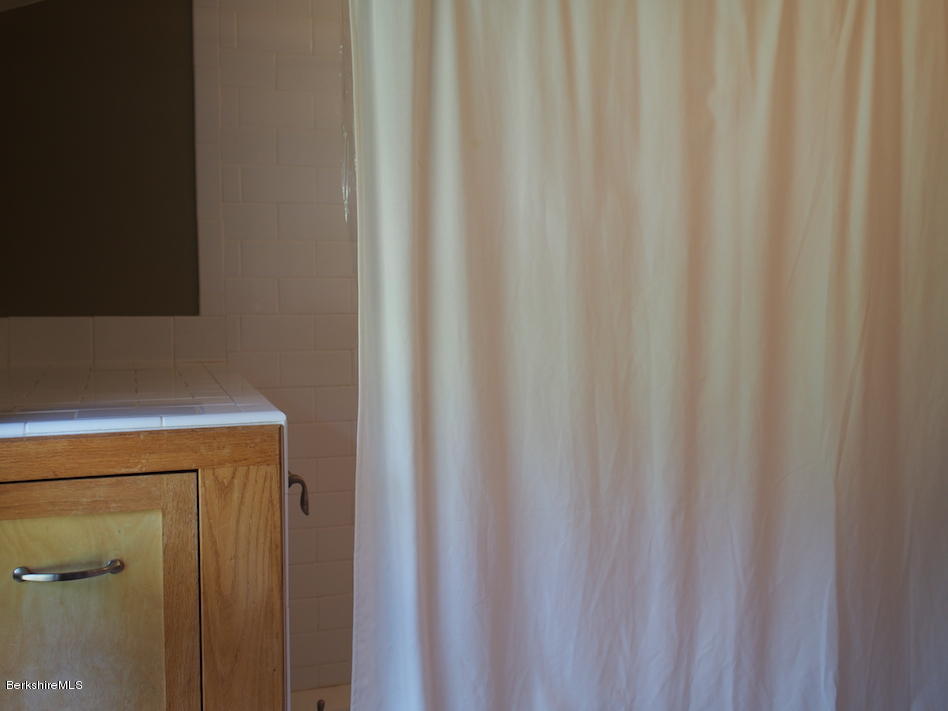 52 Central Shaft Road Florida, MA 01247 - Photo 30 of 31 a utility room with a shower curtain