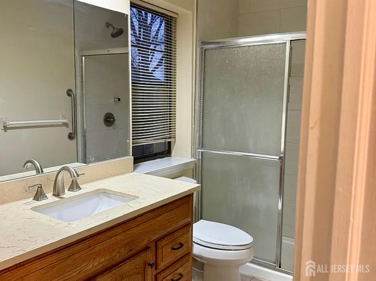 2202 Woodbridge Commons Way Iselin, NJ 08830 - Photo 5 of 6 a bathroom with a sink toilet and shower