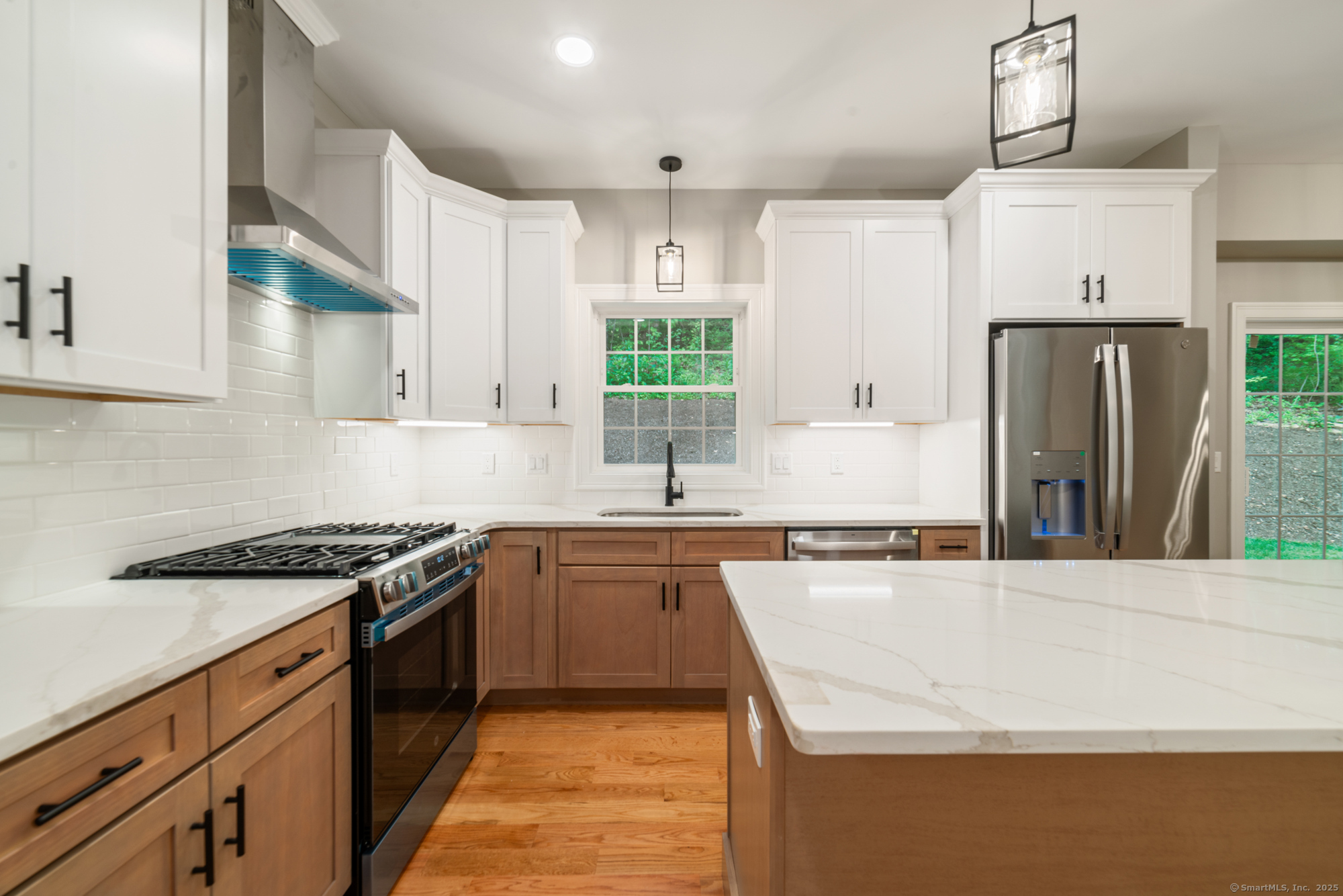 164 Fox Den Road Bristol, CT 06010 - Photo 11 of 40 a kitchen with stainless steel appliances granite countertop a sink stove and refrigerator
