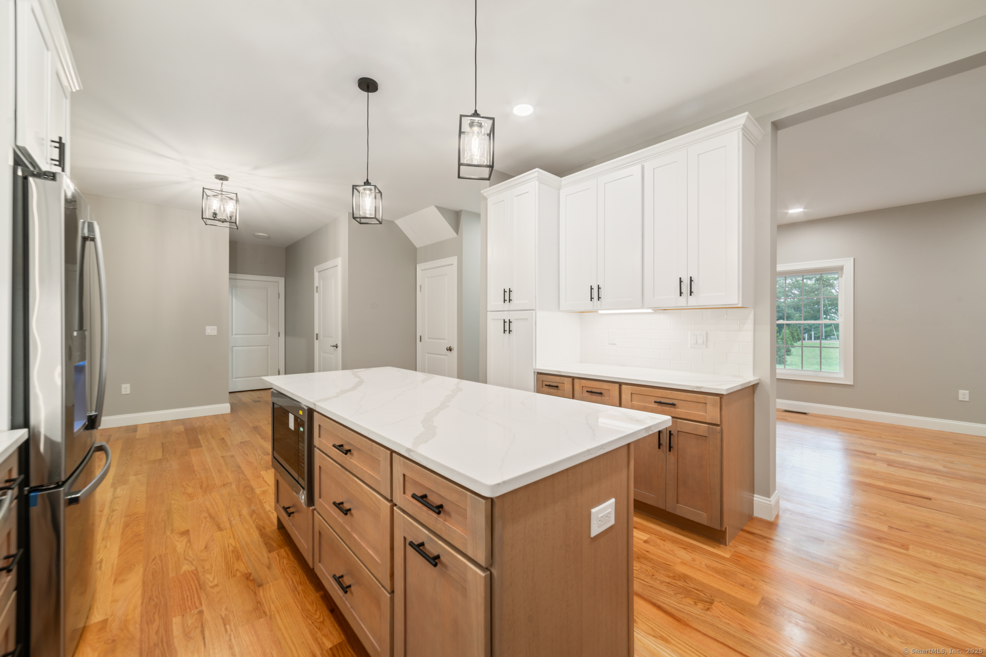 164 Fox Den Road Bristol, CT 06010 - Photo 12 of 40 a kitchen that has a sink a stove and a wooden floor