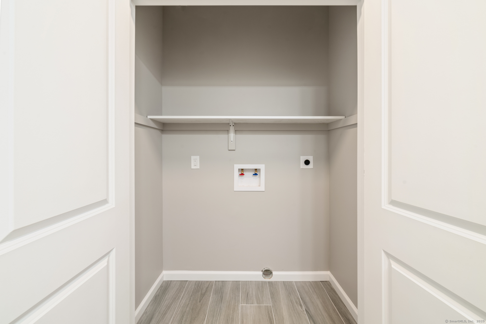 164 Fox Den Road Bristol, CT 06010 - Photo 15 of 40 a view of walk in closet with wooden floor