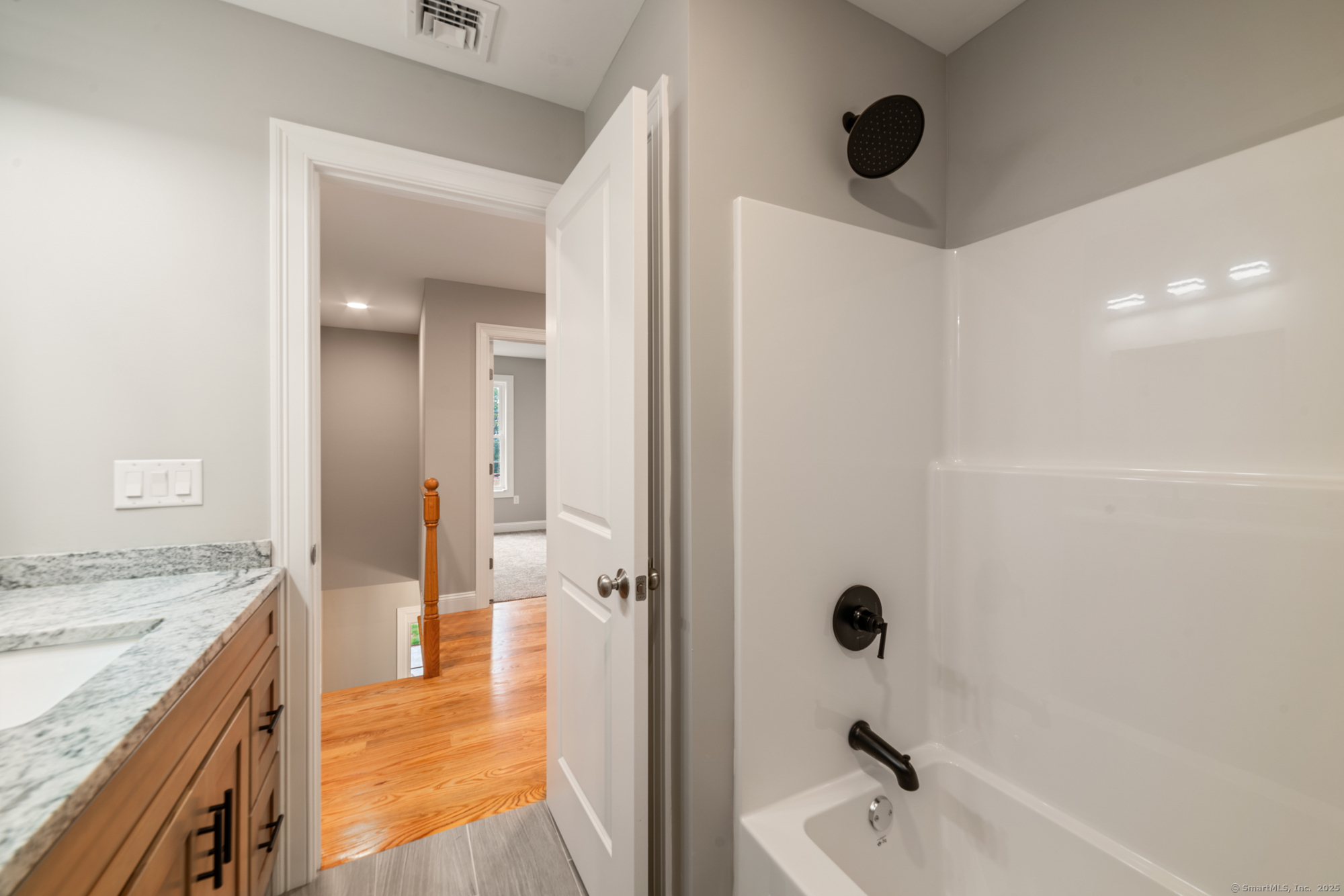 164 Fox Den Road Bristol, CT 06010 - Photo 22 of 40 view of a bathroom with a tub shower sink and mirror