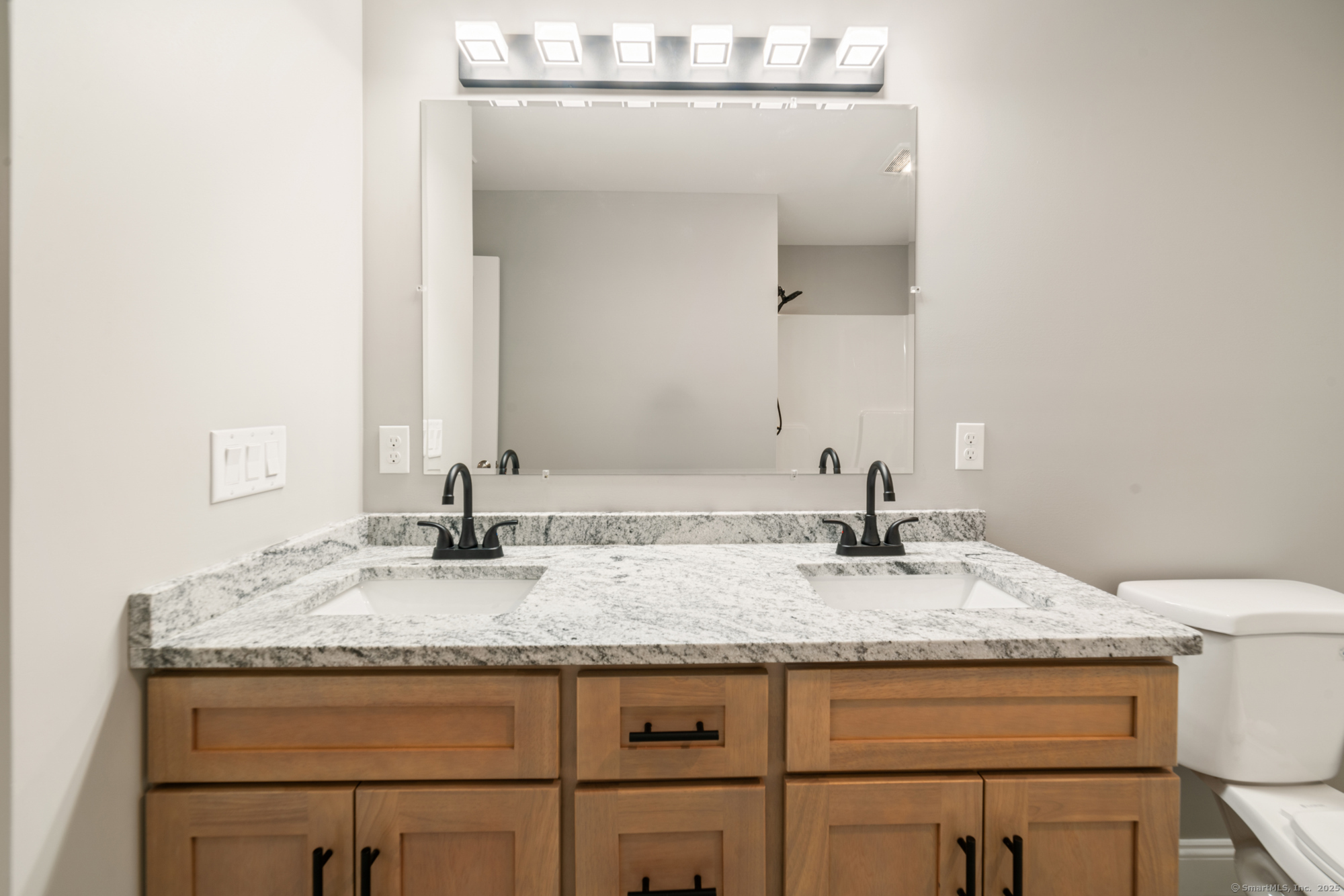 164 Fox Den Road Bristol, CT 06010 - Photo 29 of 40 a bathroom with a granite countertop sink and a mirror