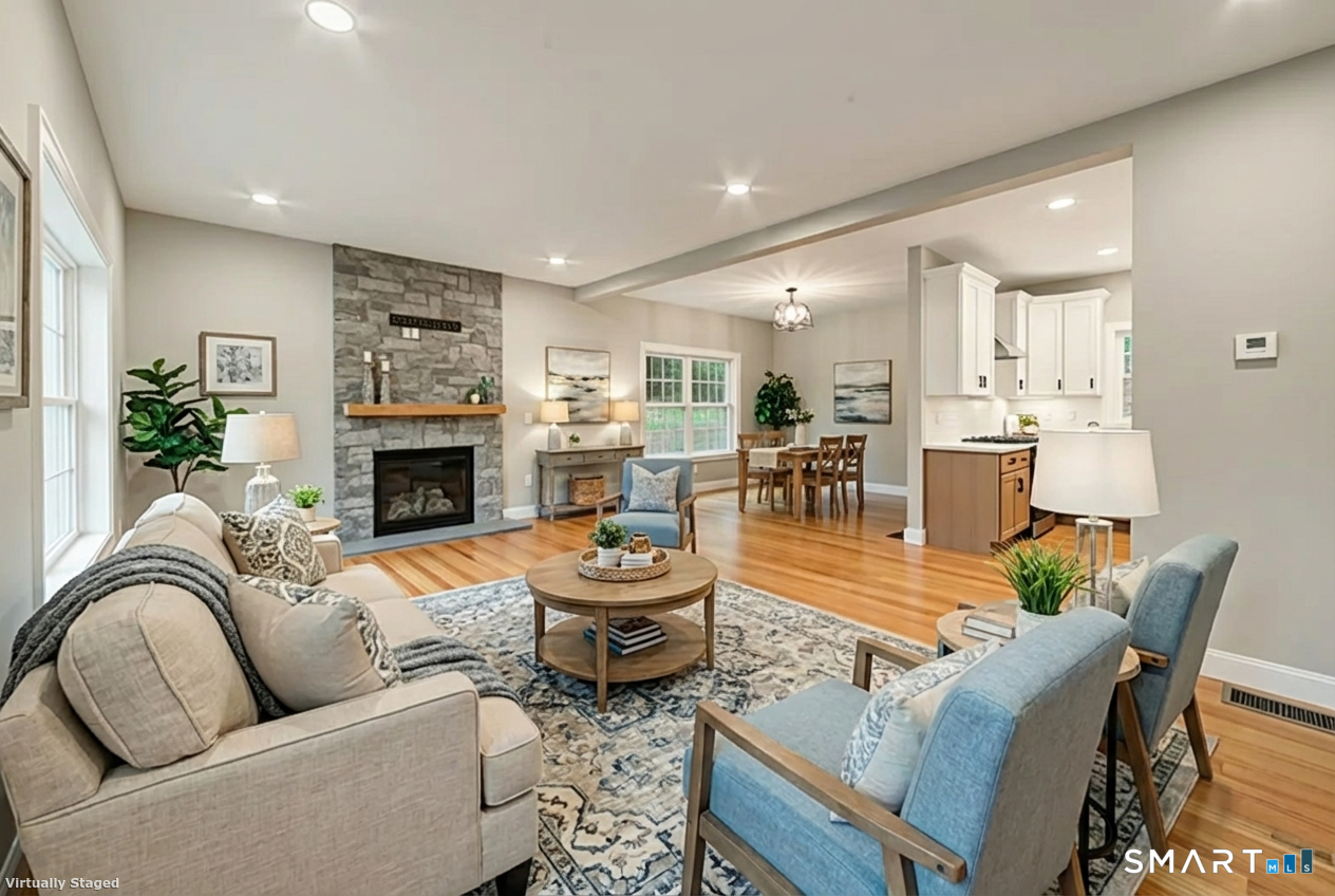 164 Fox Den Road Bristol, CT 06010 - Photo 3 of 40 a living room with furniture fireplace and a table