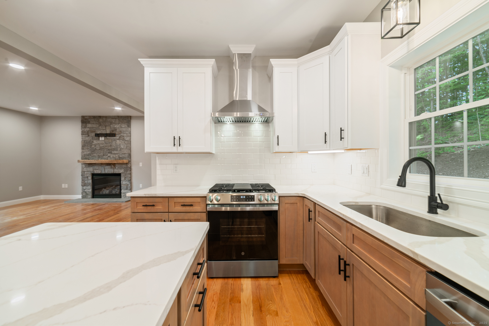 164 Fox Den Road Bristol, CT 06010 - Photo 10 of 40 a kitchen with granite countertop a stove and a sink