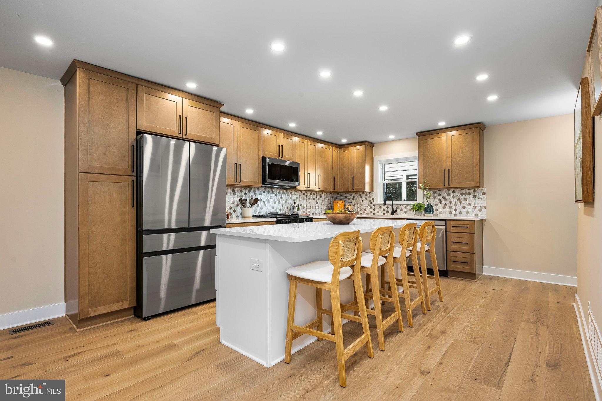 211 Bryn Mawr Avenue Bala Cynwyd, PA 19004 - Photo 13 of 59 Modern kitchen with warm wood accents.