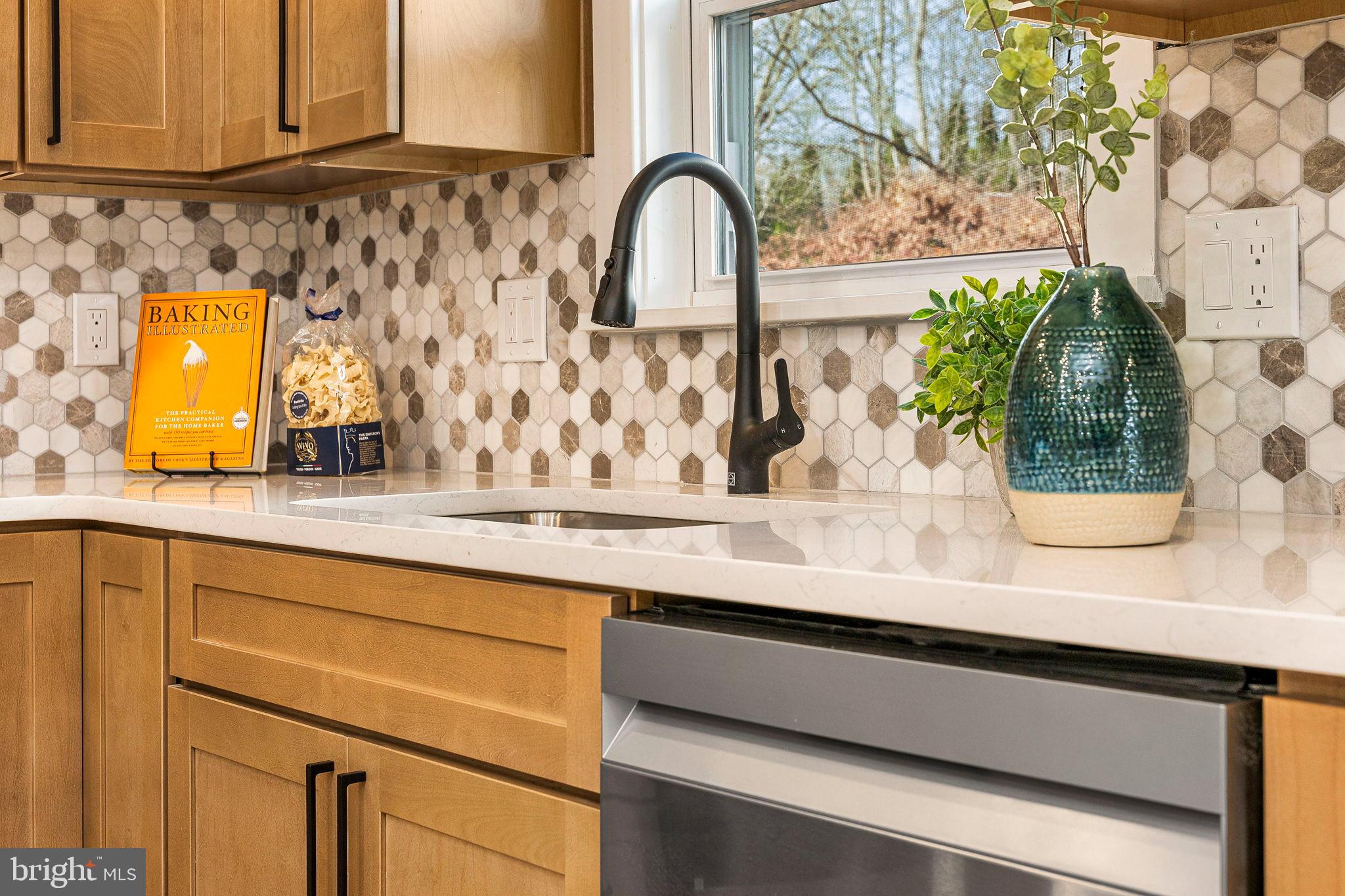 211 Bryn Mawr Avenue Bala Cynwyd, PA 19004 - Photo 14 of 59 Chic kitchen with modern hexagon tiles.