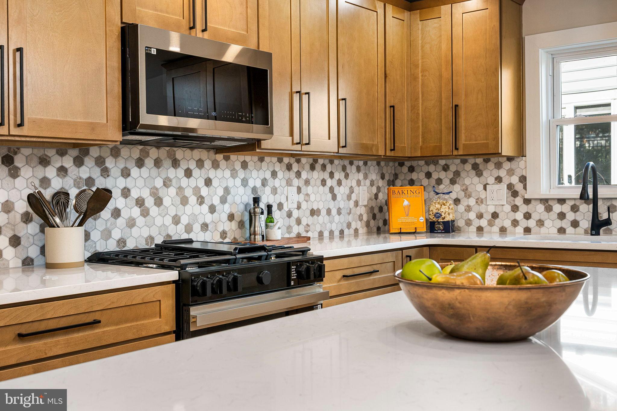 211 Bryn Mawr Avenue Bala Cynwyd, PA 19004 - Photo 15 of 59 Modern kitchen with warm wood accents.