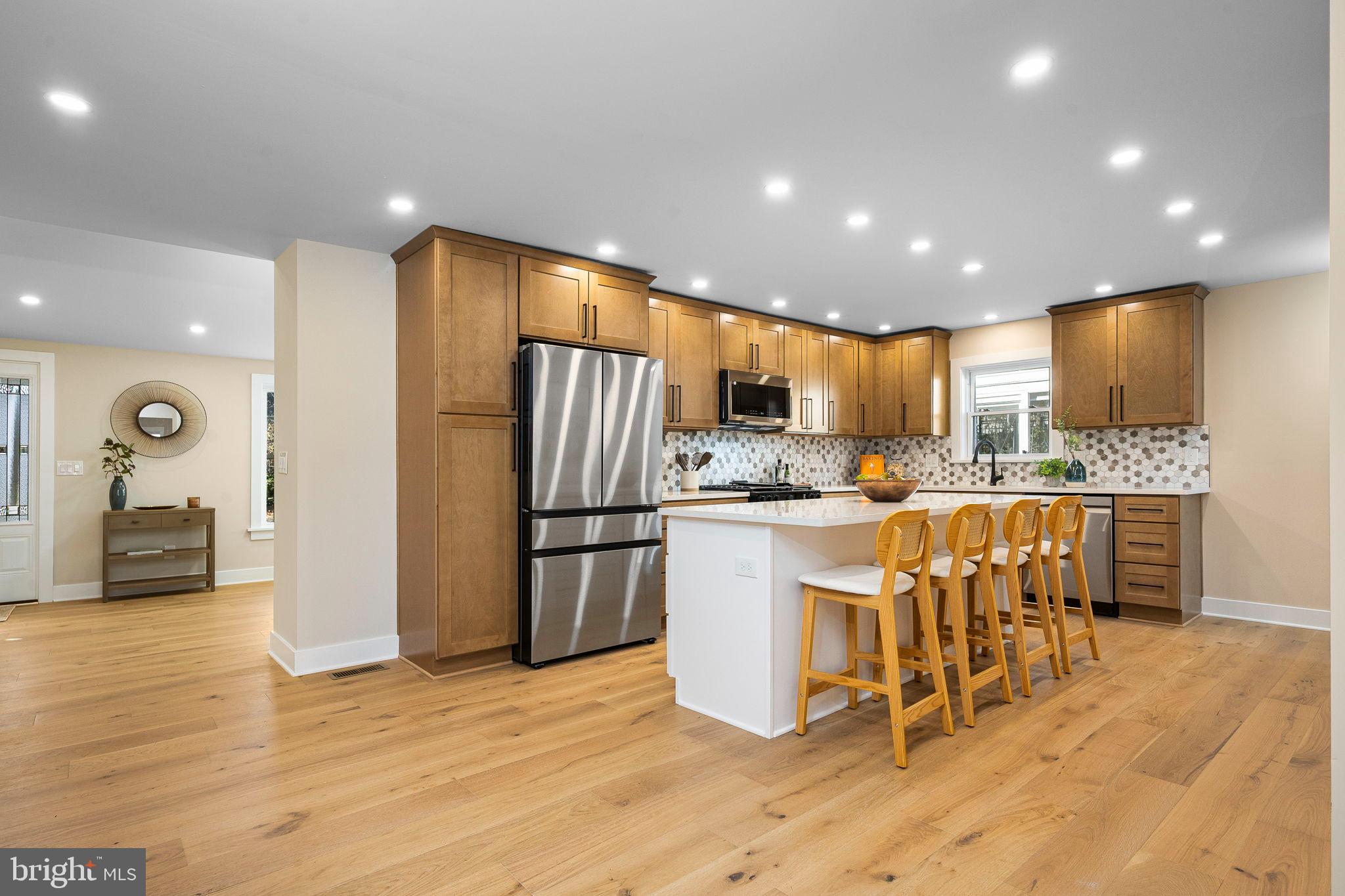 211 Bryn Mawr Avenue Bala Cynwyd, PA 19004 - Photo 16 of 59 Modern kitchen with warm wood accents.