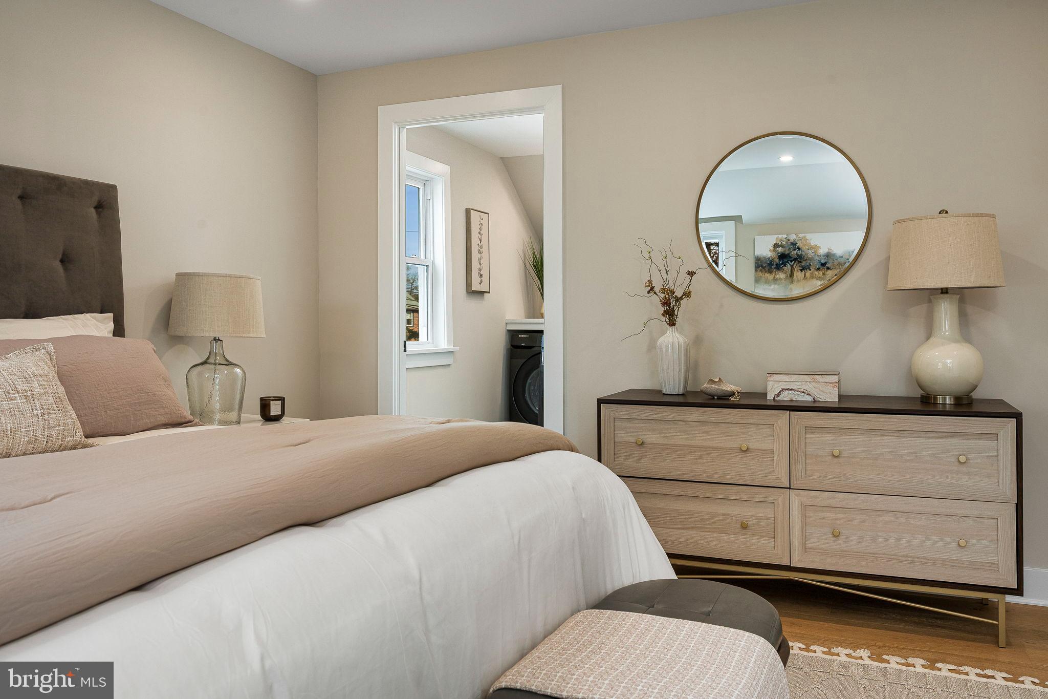 211 Bryn Mawr Avenue Bala Cynwyd, PA 19004 - Photo 29 of 59 Serene bedroom with modern elegance.