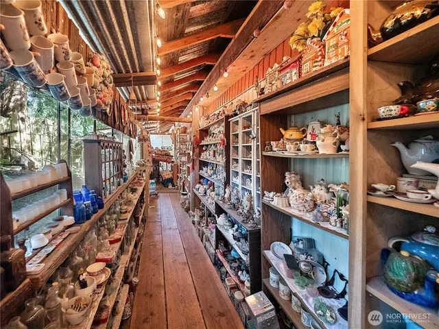 a view of a patio with chairs next to a yard